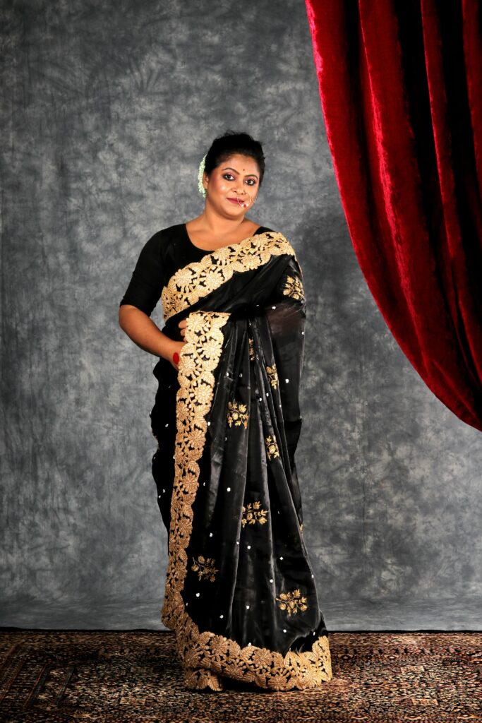 black tissue saree with golden embroidery