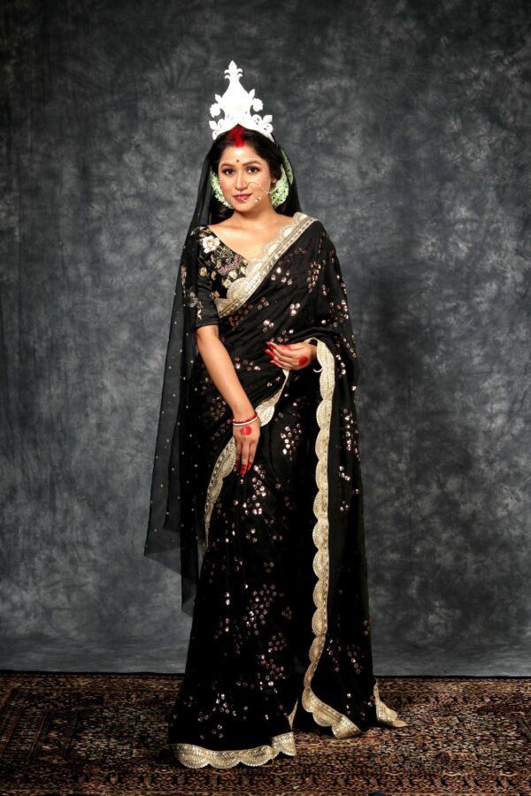black gorgette embroidered saree with gold sequin work